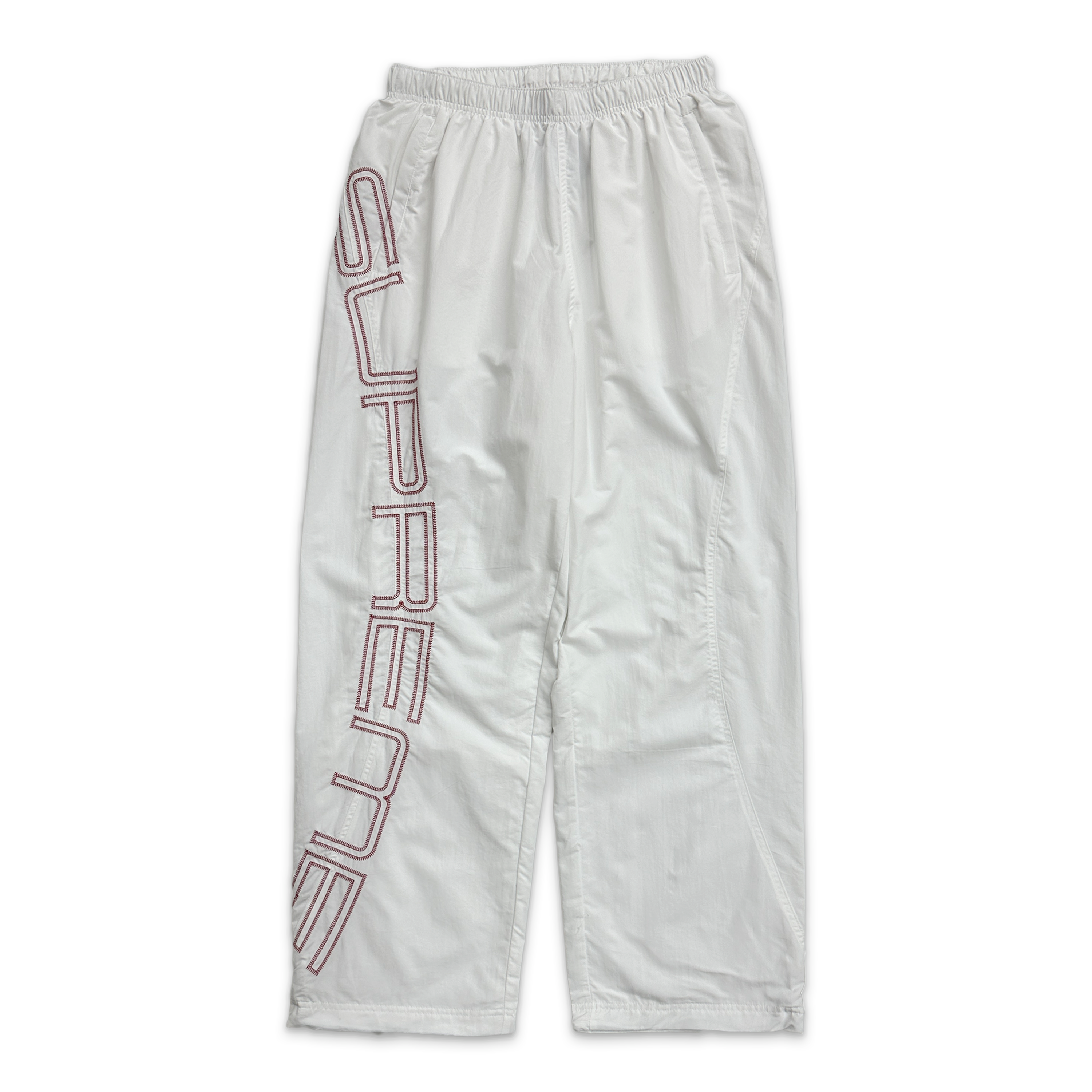 Supreme, Embroidered Spellout Track Pants "White"